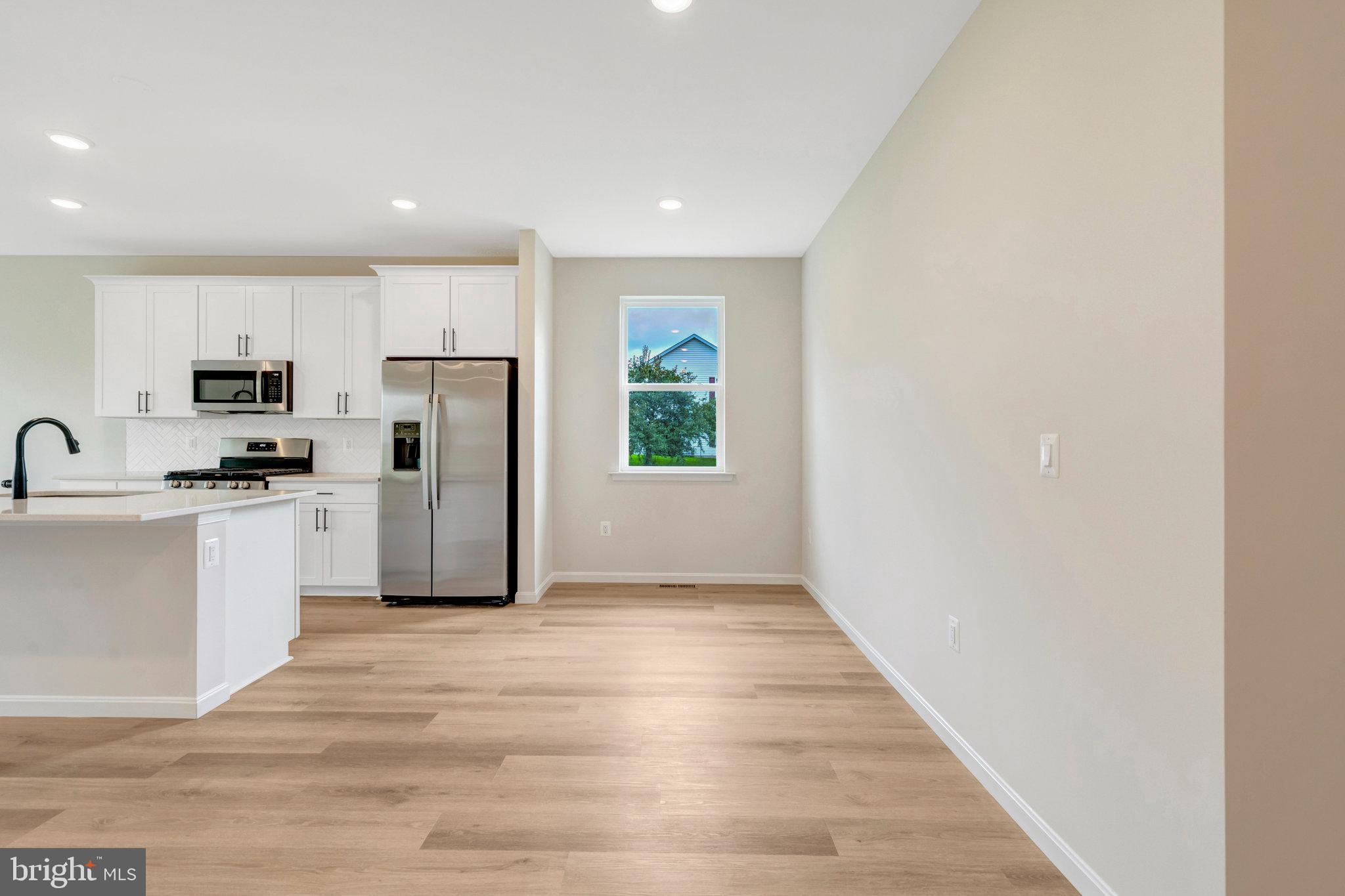 100 Midsummer Lane Middletown, VA 22645 - Photo 15 of 47 a view of kitchen with sink microwave and refrigerator