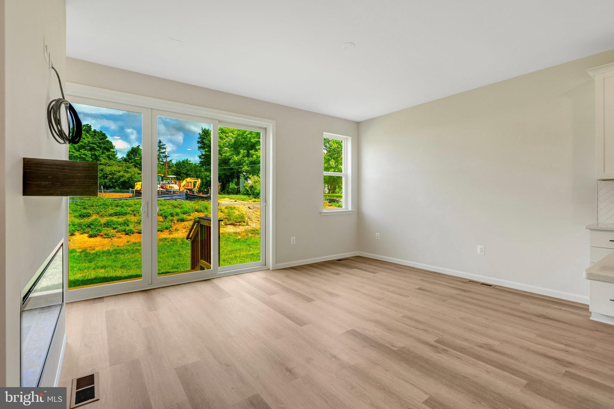 100 Midsummer Lane Middletown, VA 22645 - Photo 23 of 47 a view of an empty room with a window and wooden floor