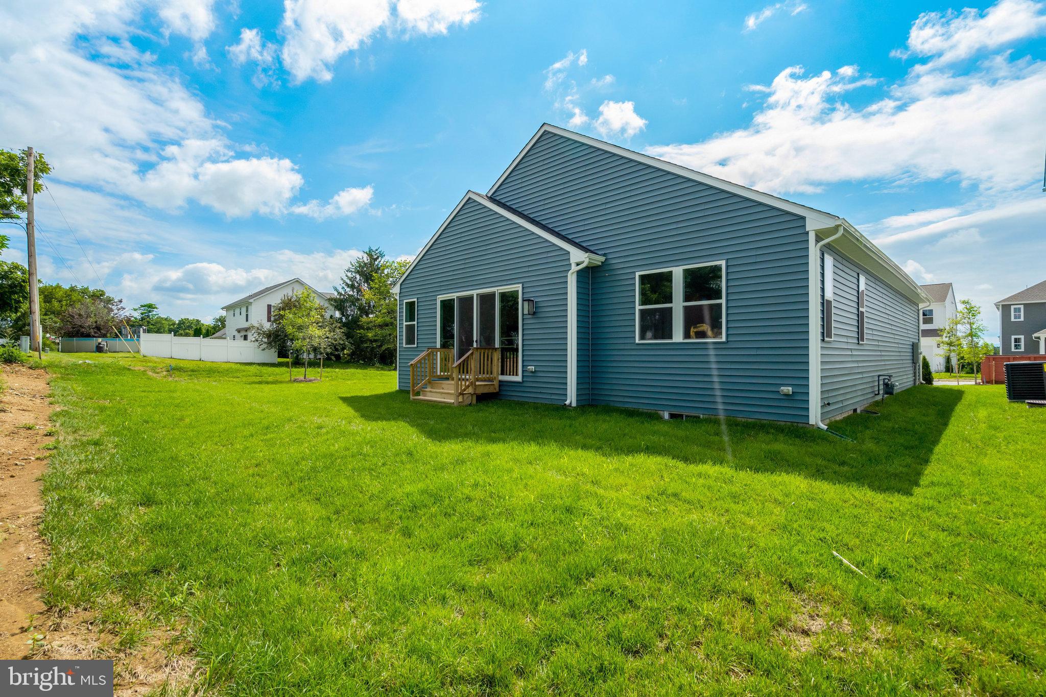 100 Midsummer Lane Middletown, VA 22645 - Photo 43 of 47 a view of a backyard with plants and a garden