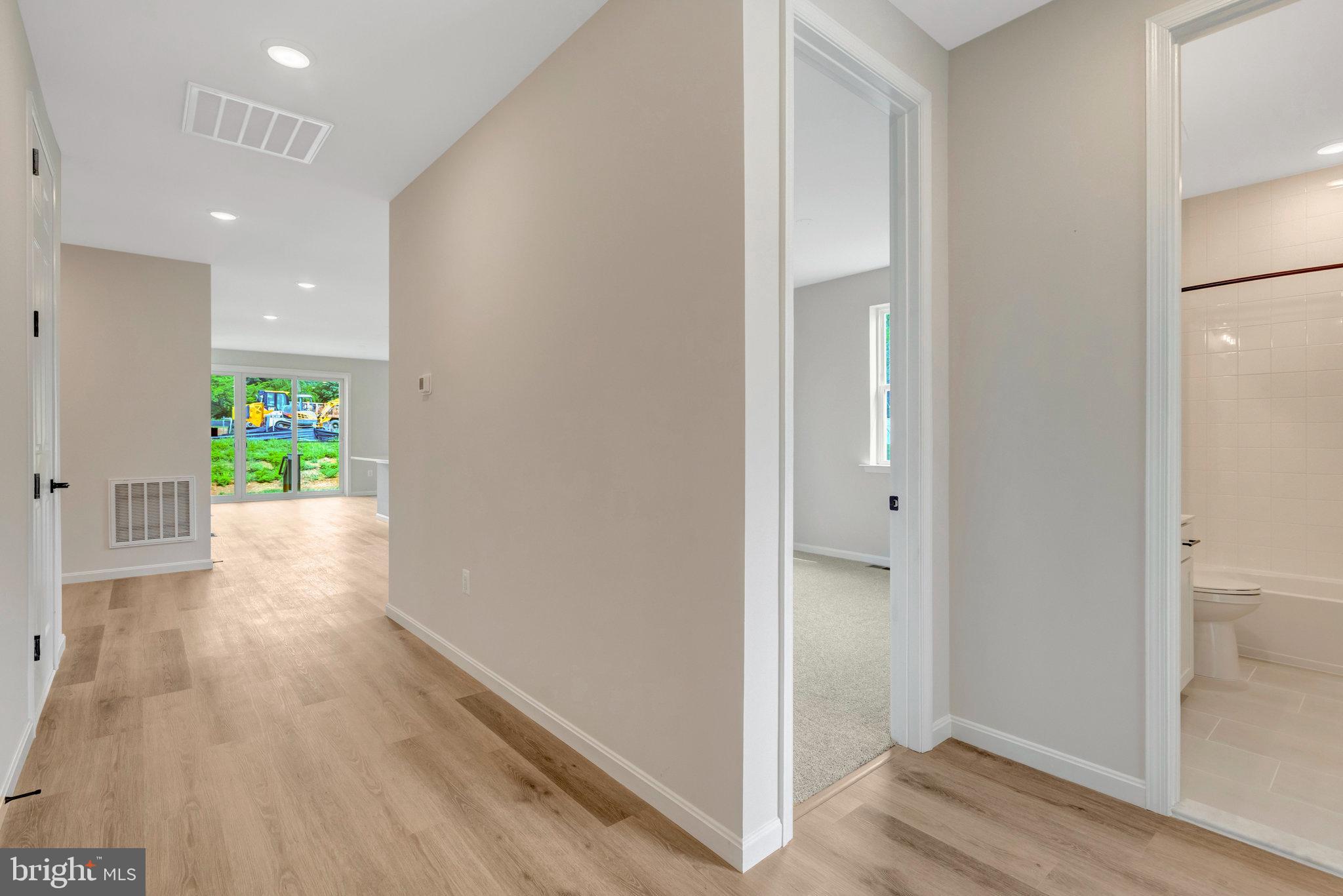 100 Midsummer Lane Middletown, VA 22645 - Photo 5 of 47 a view of hallway with wooden floor