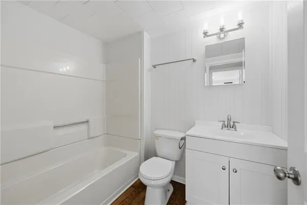 a bathroom with a sink toilet and bathtub