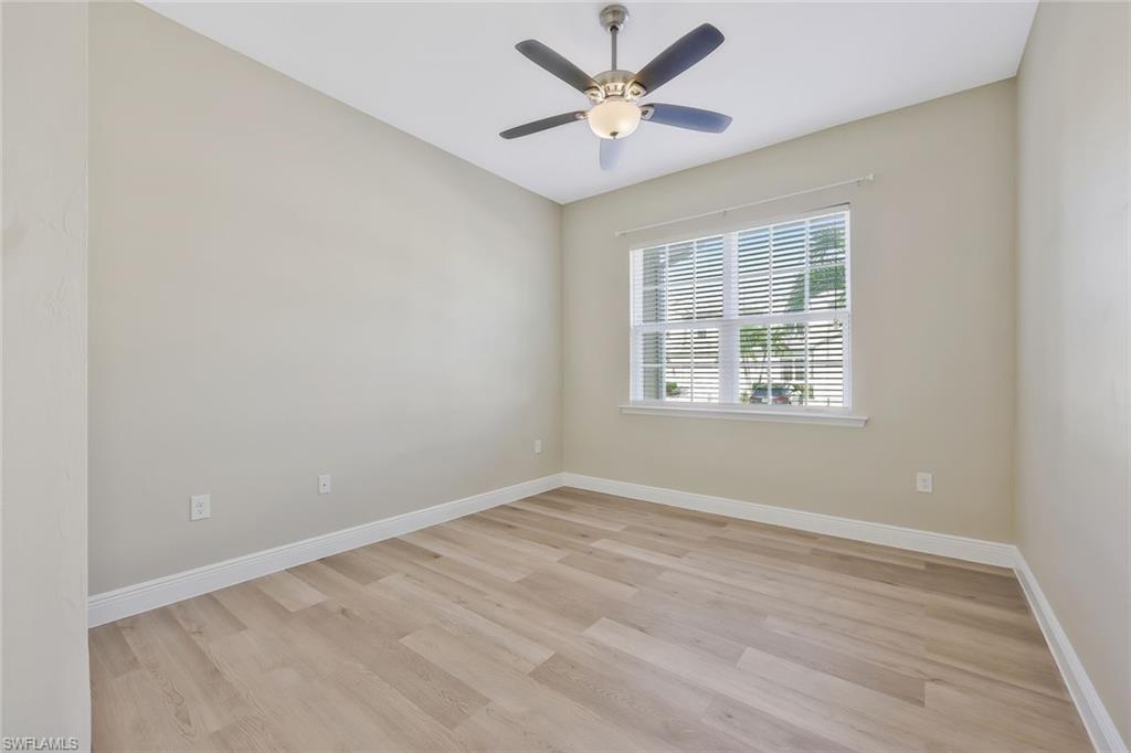 18225 Creekside Preserve Loop, Unit 102 Fort Myers, FL 33908 - Photo 18 of 25 Unfurnished room featuring light wood finished floors and a ceiling fan