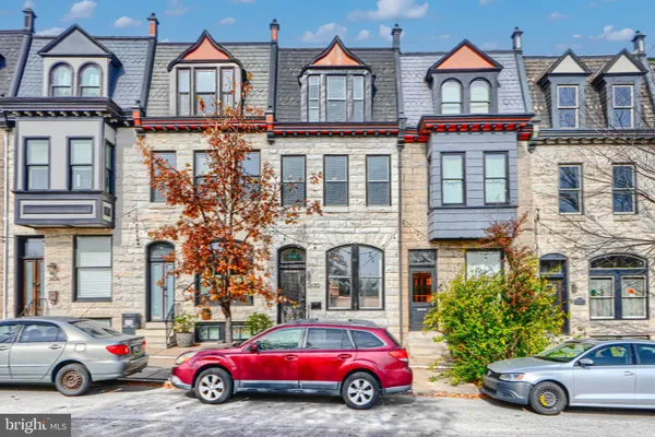 a car parked in front of a house