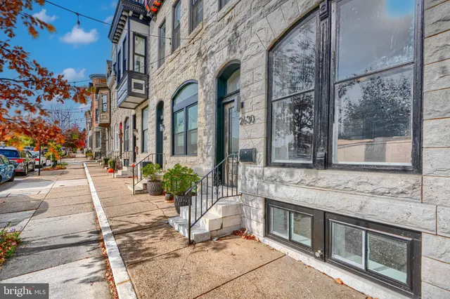 a view of a patio with table and chairs and potted plants