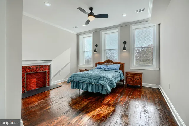 a bathroom with a tub sink vanity and mirror