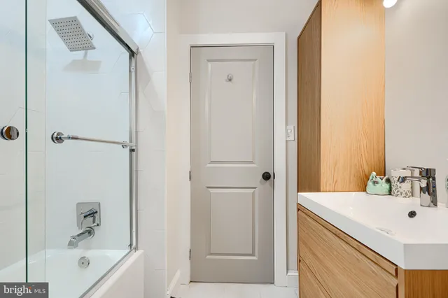 a view of staircase with wooden floor and a potted plant