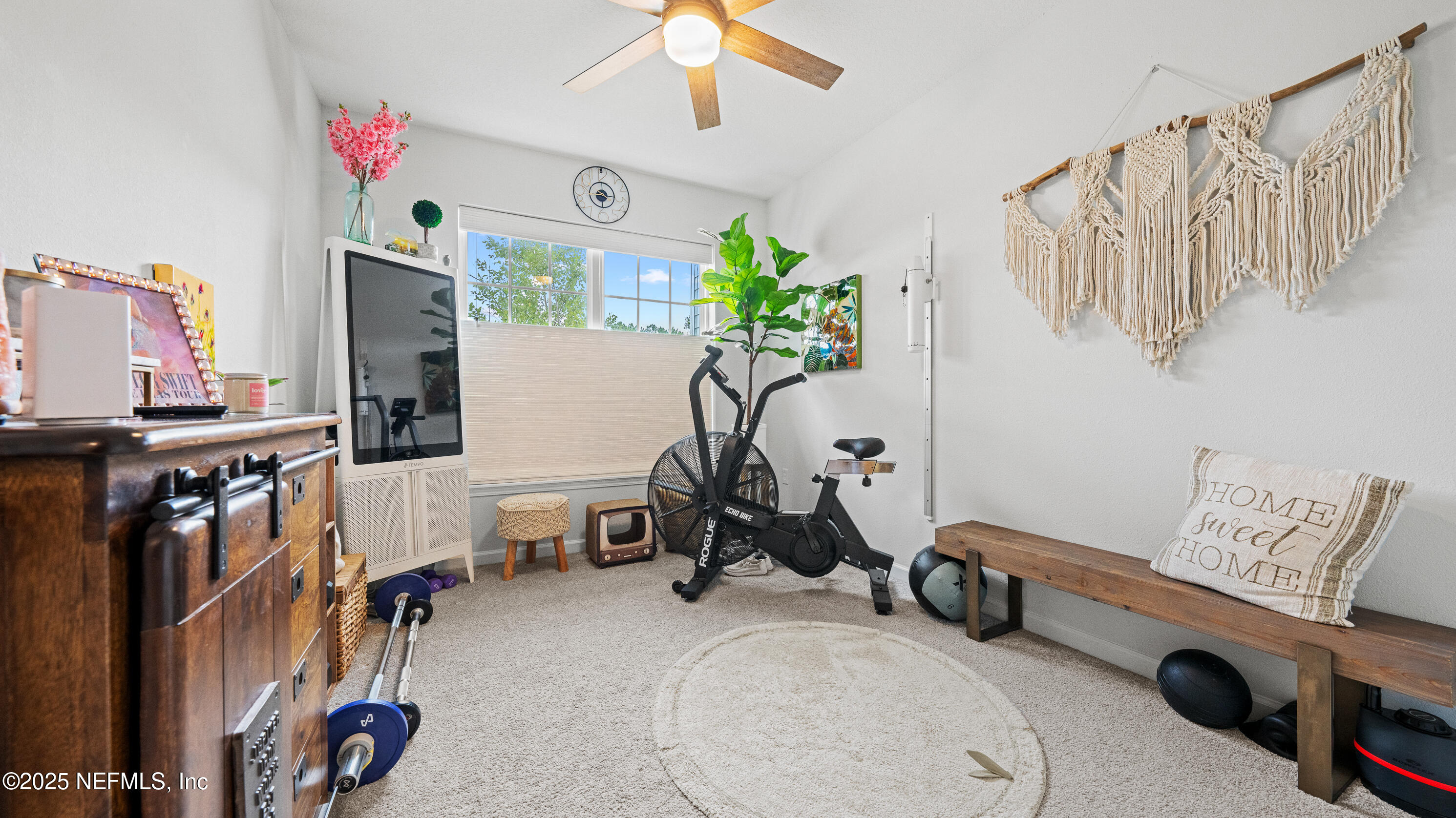 327 Charlie Way St. Augustine, FL 32095 - Photo 16 of 22 a view of a room with gym equipment