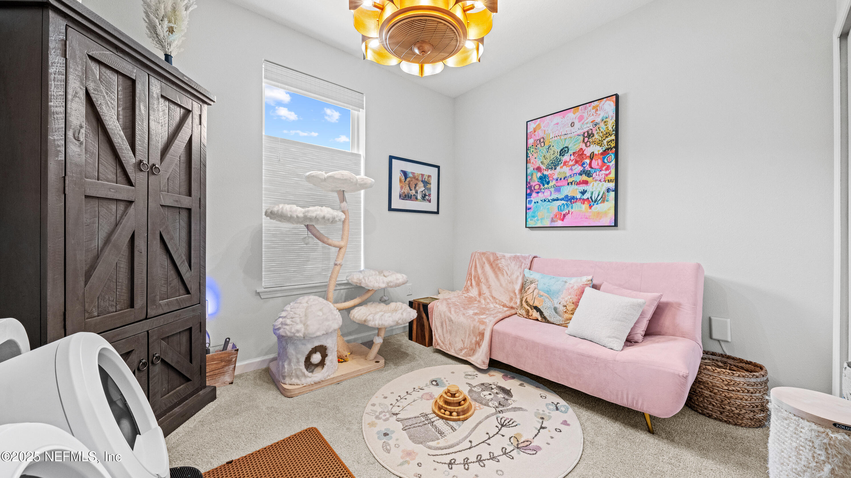 327 Charlie Way St. Augustine, FL 32095 - Photo 17 of 22 a living room with furniture and a chandelier