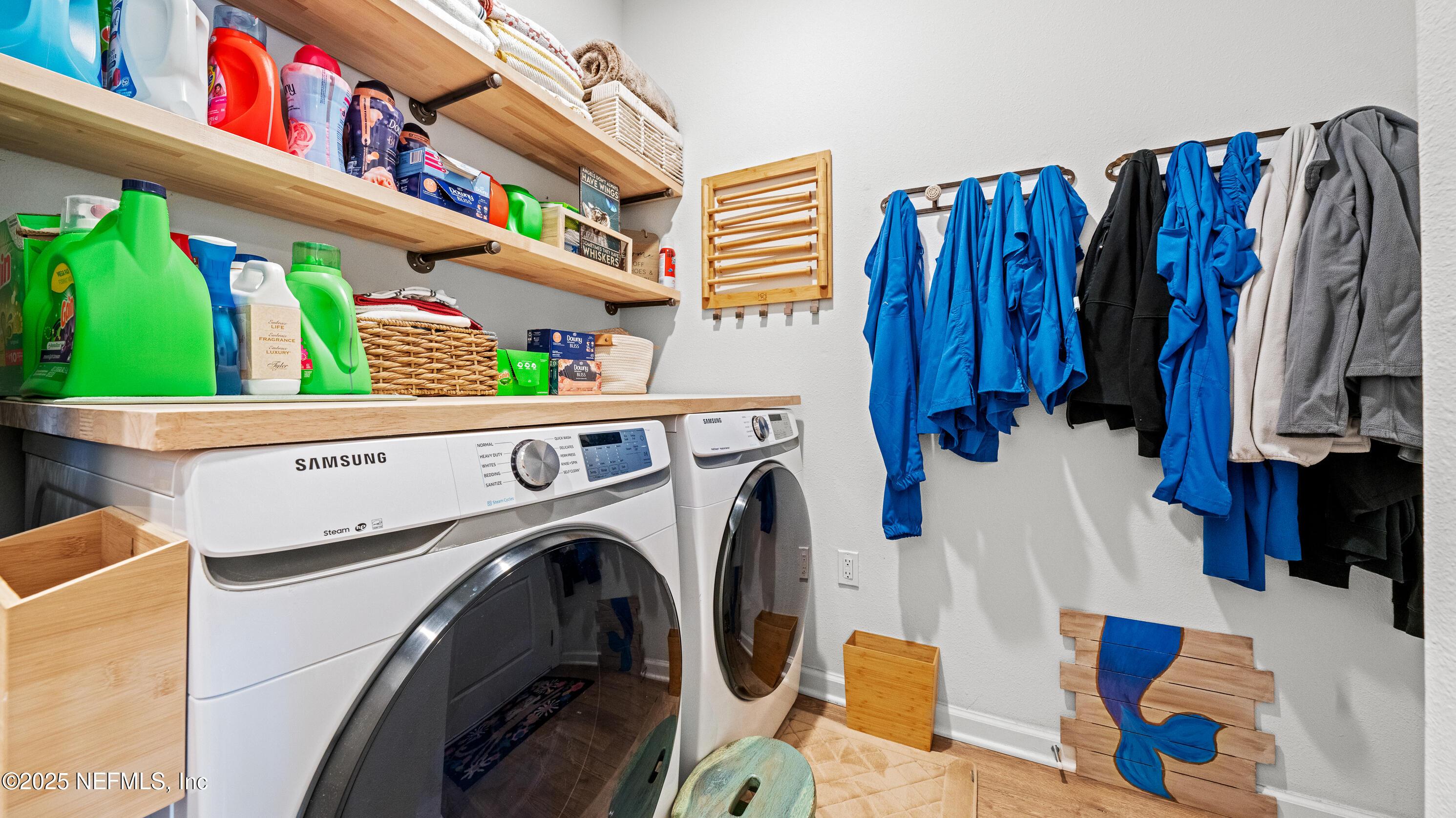 327 Charlie Way St. Augustine, FL 32095 - Photo 20 of 22 a view of walk in closet with clothes and shoes
