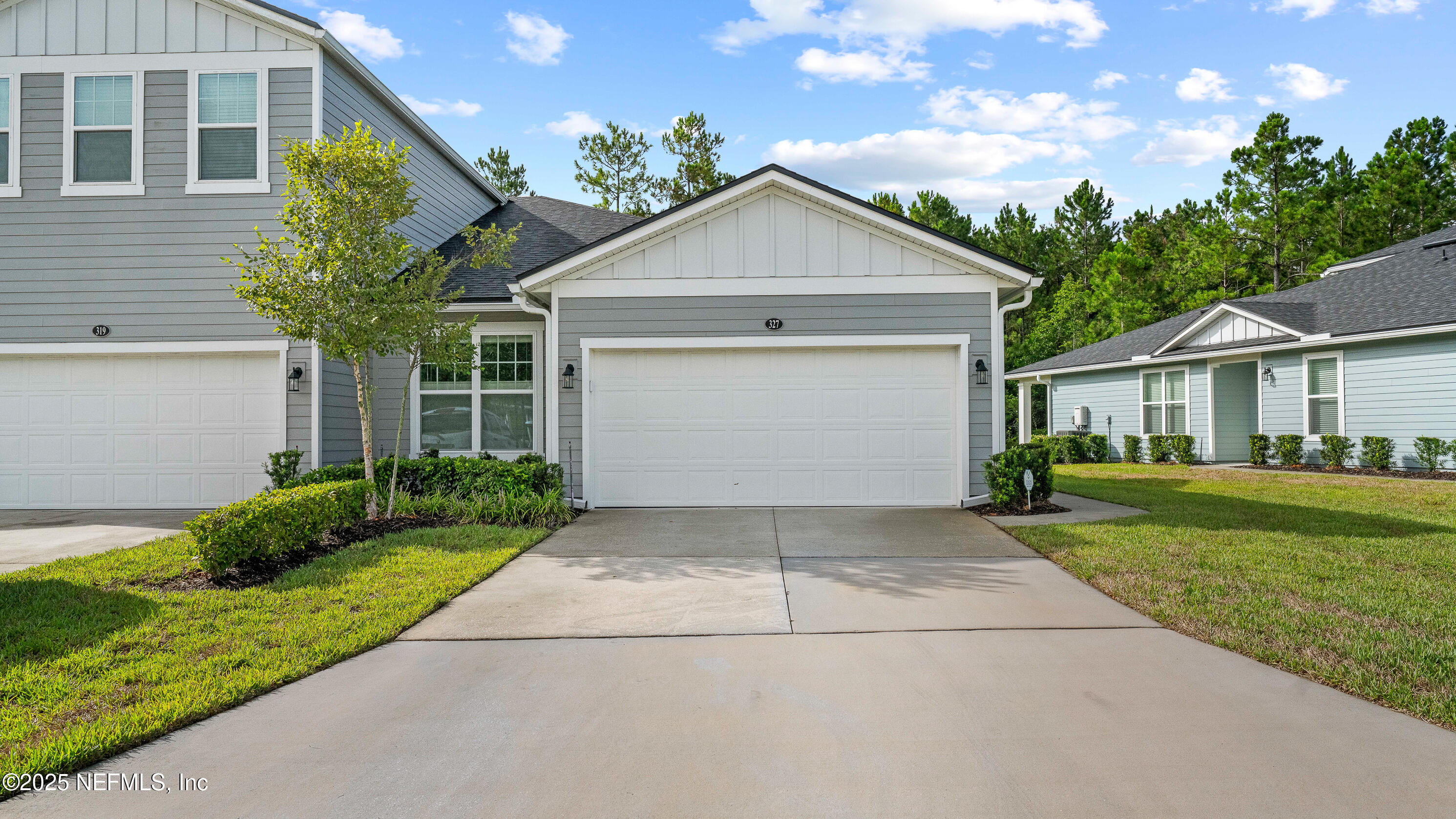 327 Charlie Way St. Augustine, FL 32095 - Photo 2 of 22 a view of a house with yard and tree s