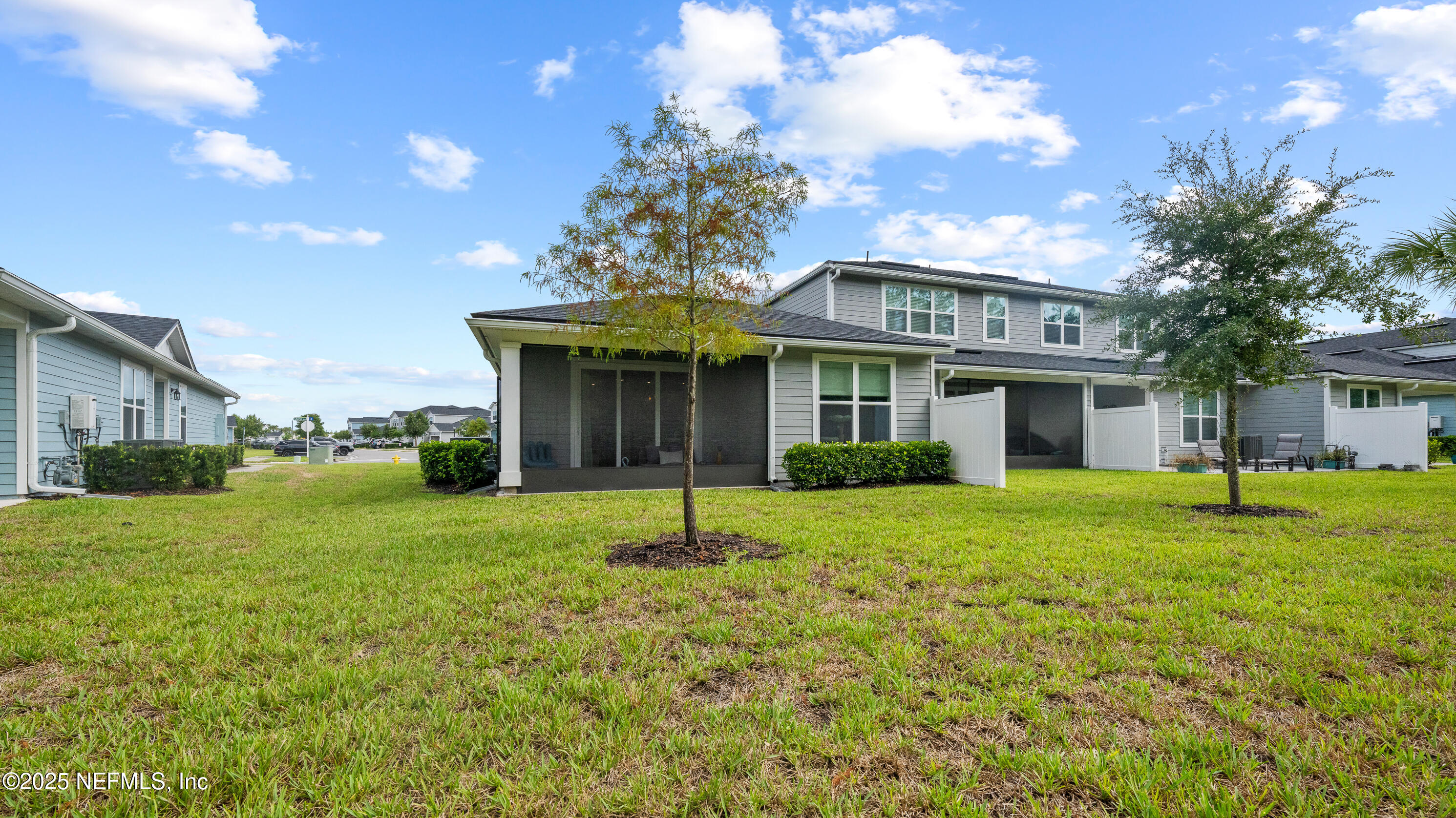 327 Charlie Way St. Augustine, FL 32095 - Photo 22 of 22 a view of a house with a back yard