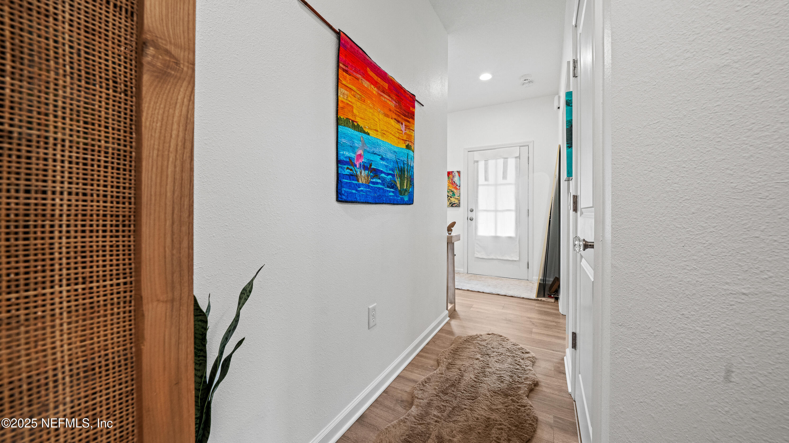 327 Charlie Way St. Augustine, FL 32095 - Photo 4 of 22 a view of a hallway with furniture and front door
