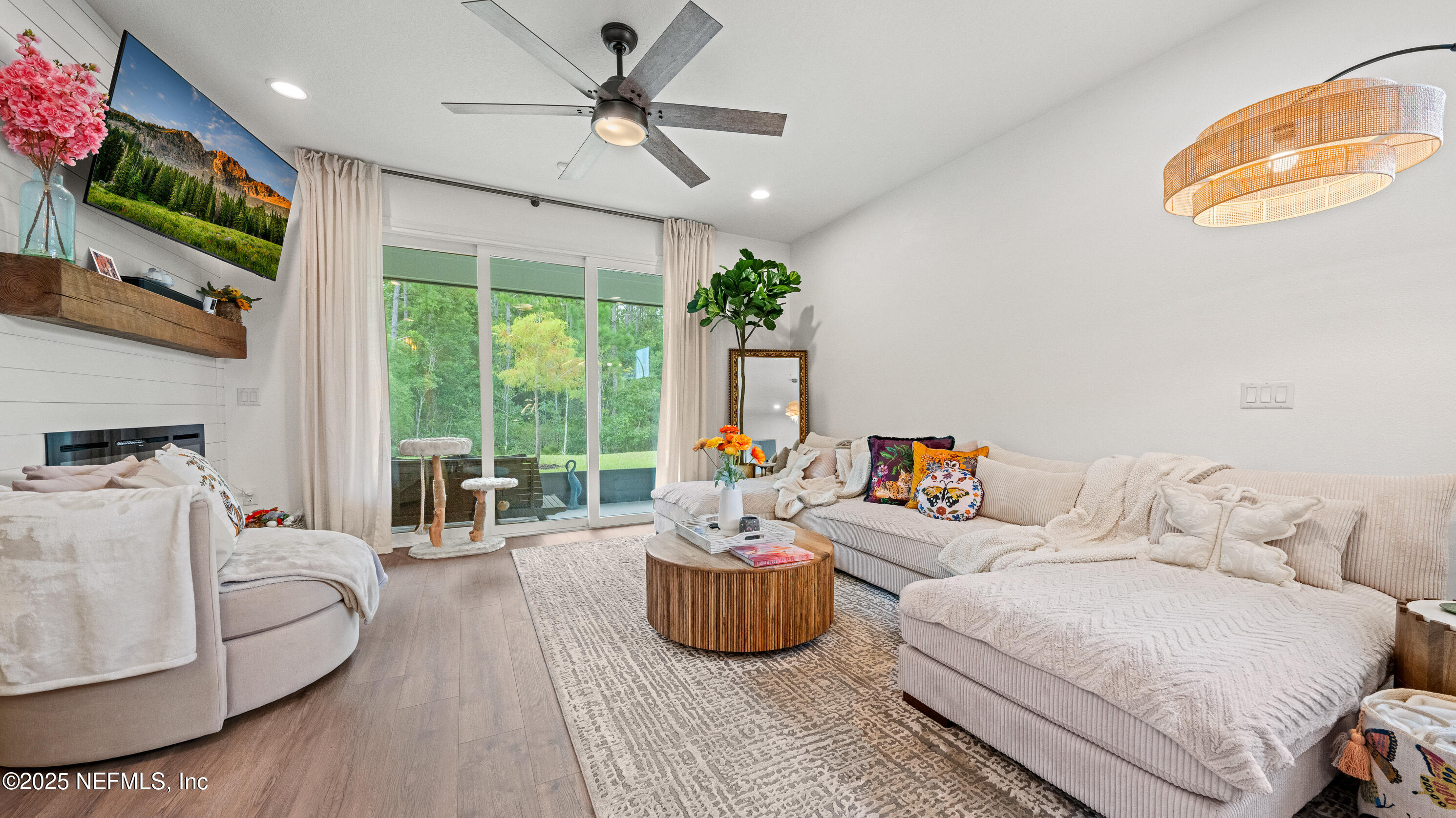 327 Charlie Way St. Augustine, FL 32095 - Photo 9 of 22 a living room with furniture and a flat screen tv