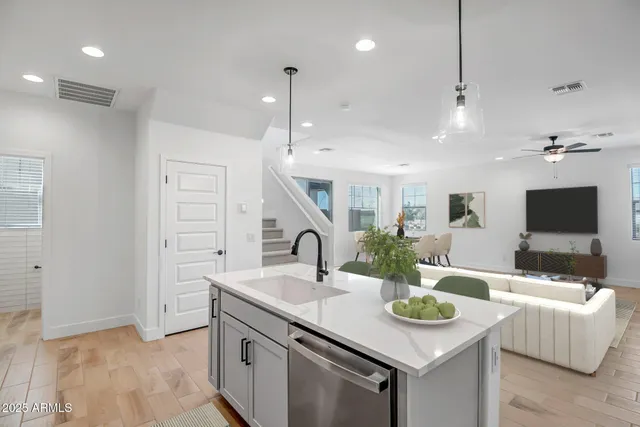 a kitchen with a sink and a refrigerator