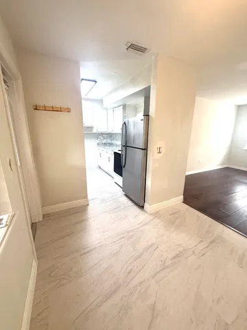 a view of a kitchen with a sink