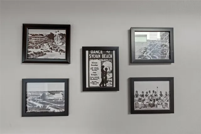 a view of a hallway with paintings on the wall