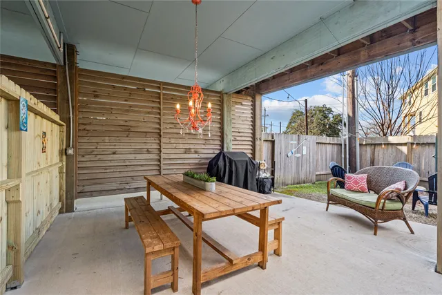 a view of a patio with a table chairs and a patio