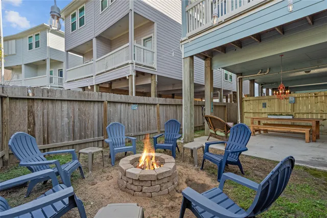 a backyard of a house with outdoor seating