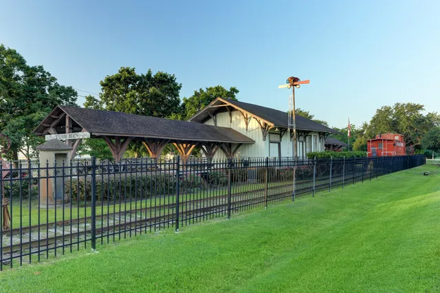 a view of a park with a small yard and plants