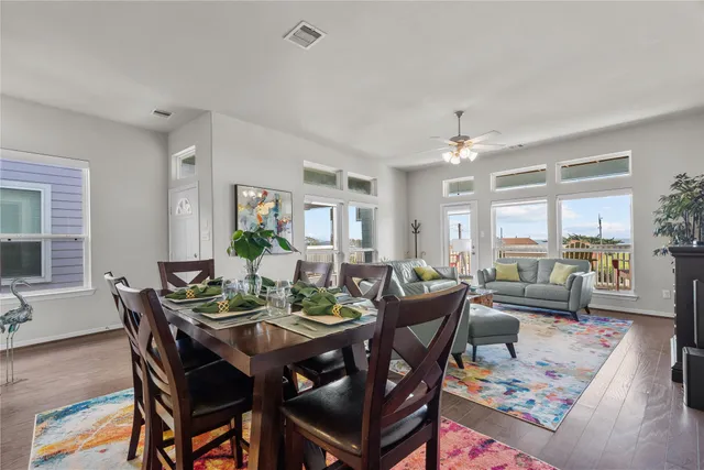 a view of a dining room with furniture window and wooden floor