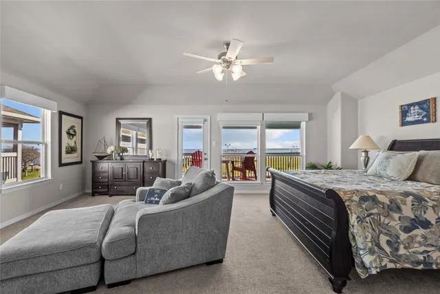 a bed room with a bed couch and a window