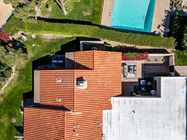 a view of a patio with table and chairs and potted plants