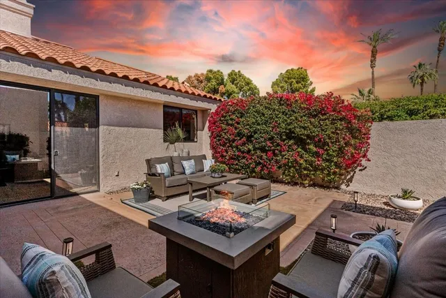 a outdoor living space with furniture and a potted plant