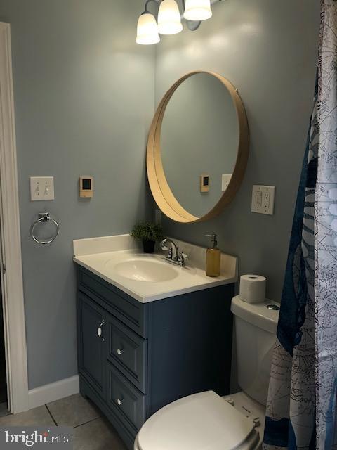 3222 Lynch Road Sparrows Point, MD 21219 - Photo 21 of 45 a bathroom with a toilet sink vanity and mirror