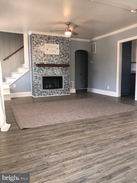 3222 Lynch Road Sparrows Point, MD 21219 - Photo 8 of 45 a view of empty room with wooden floor and fireplace