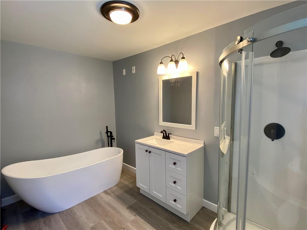 116 Nassau Street Uniontown, PA 15401 - Photo 11 of 25 a bathroom with a tub sink and mirror