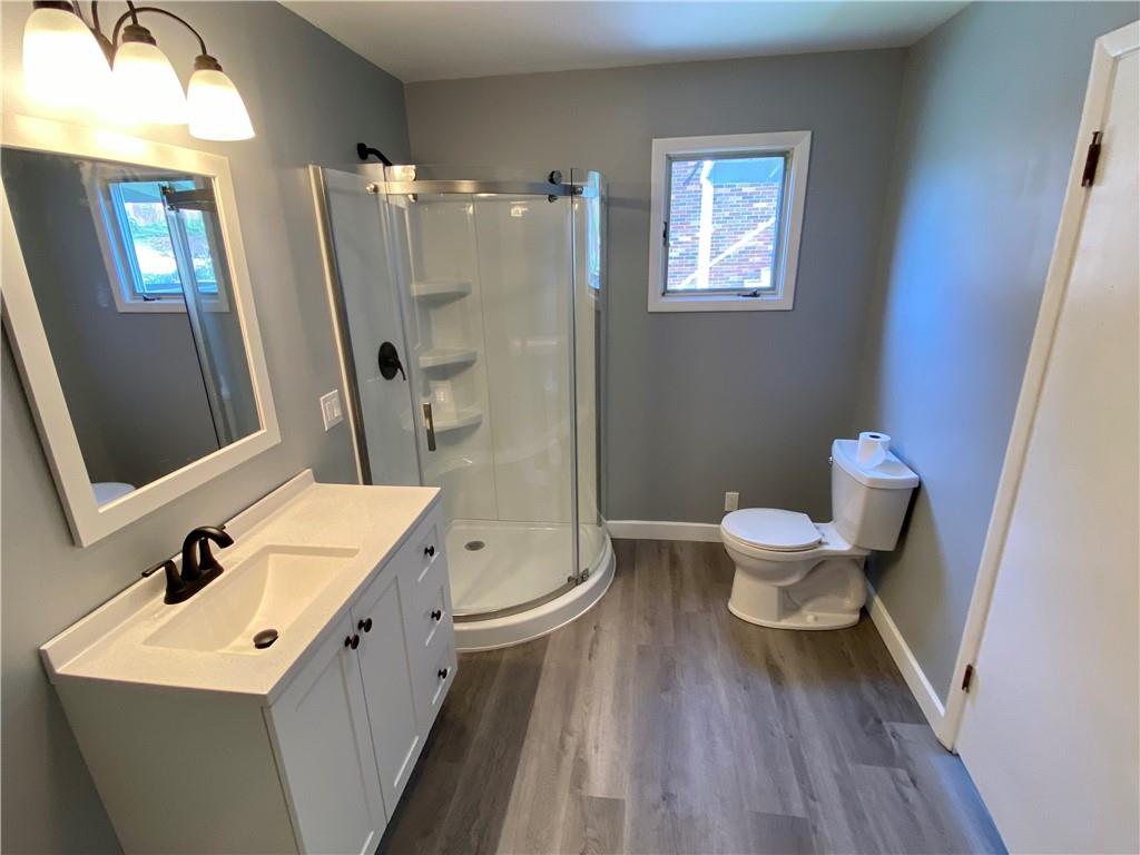 116 Nassau Street Uniontown, PA 15401 - Photo 12 of 25 a bathroom with a sink a toilet a mirror and shower