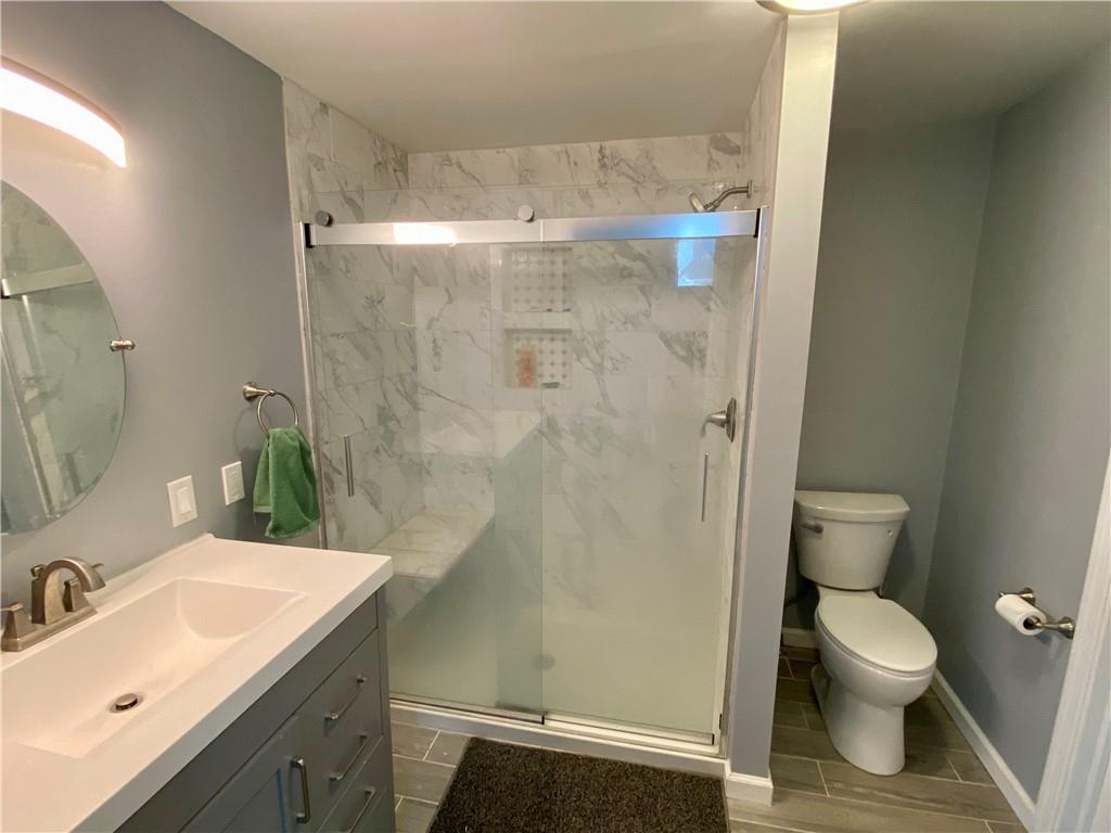 116 Nassau Street Uniontown, PA 15401 - Photo 14 of 25 a bathroom with a sink a toilet and shower