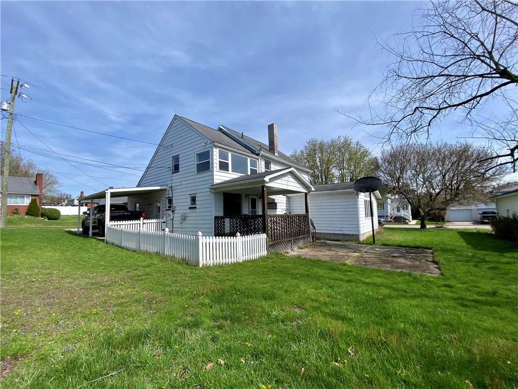 116 Nassau Street Uniontown, PA 15401 - Photo 23 of 25 a front view of a house with a yard and trees