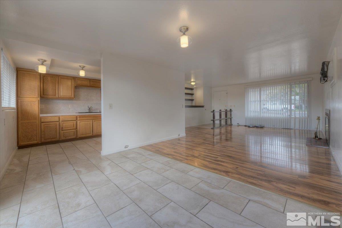 1660 Carlin Street Reno, NV 89503 - Photo 8 of 27 a view of a kitchen with a sink and an empty room