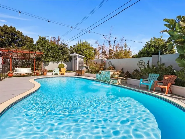 a view of a swimming pool with a patio