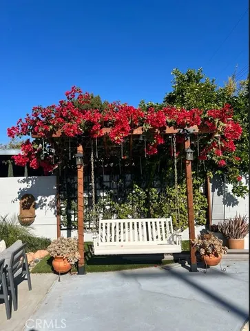 a view of a street with a bench in front of it