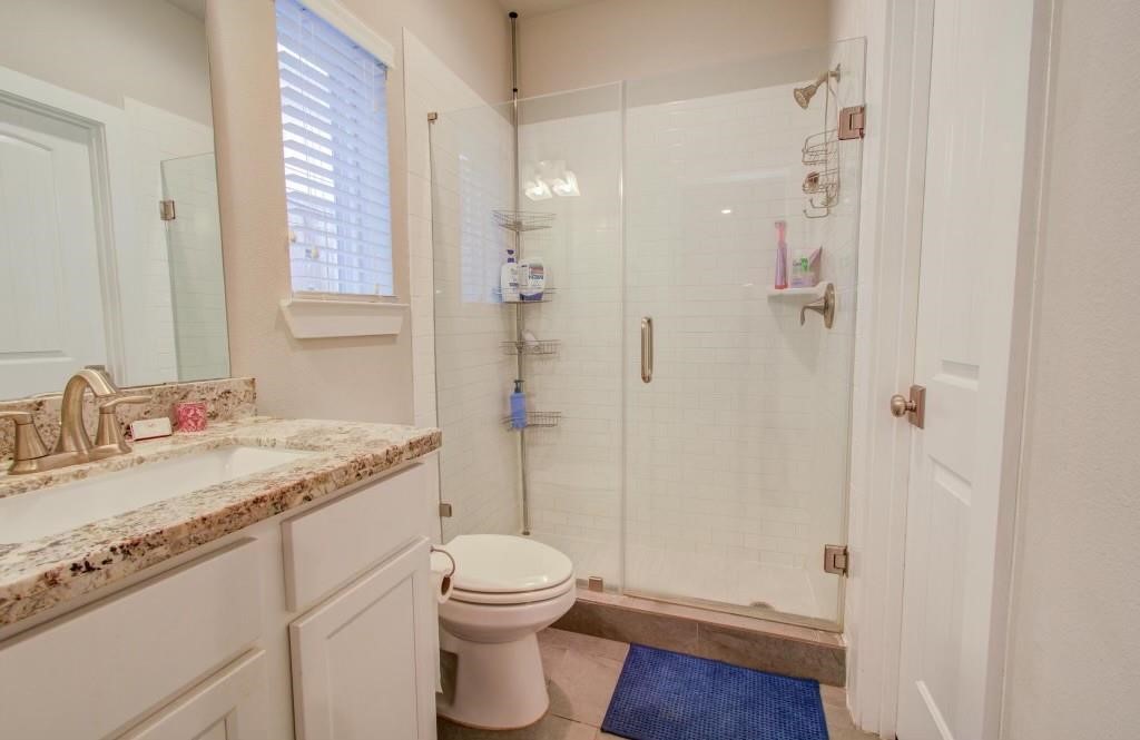 243 West 27th Street Houston, TX 77008 - Photo 20 of 31 a bathroom with a granite countertop sink toilet and shower