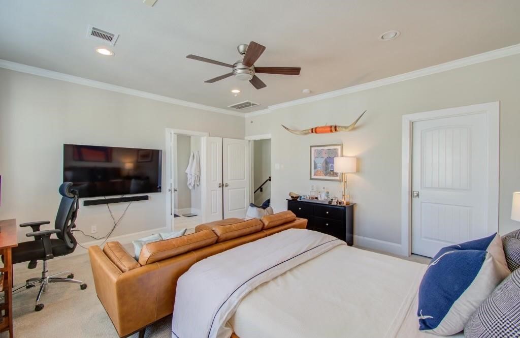 243 West 27th Street Houston, TX 77008 - Photo 6 of 31 a bedroom with a bed and a flat screen tv