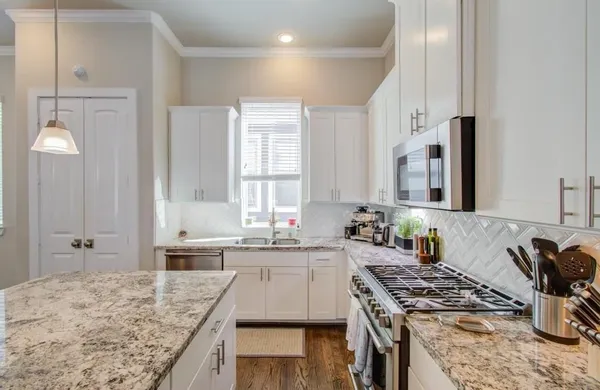 a kitchen with a stove and a sink