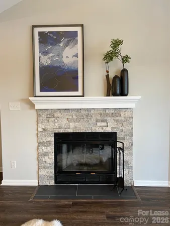 a living room with a fireplace and a fireplace