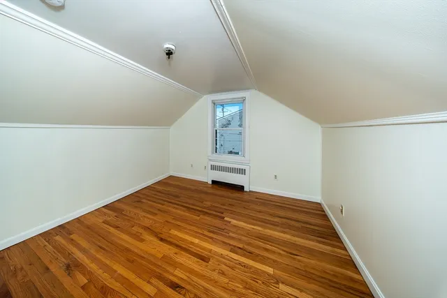 a view of a room with wooden floor and stairs