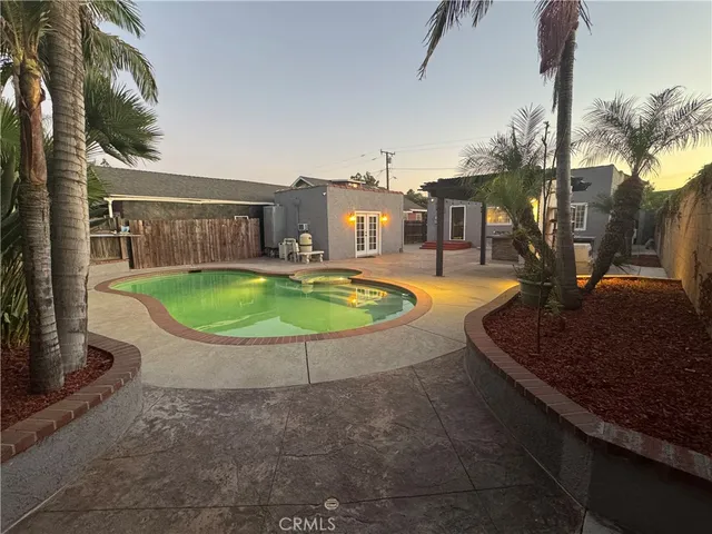 a view of a swimming pool with a patio
