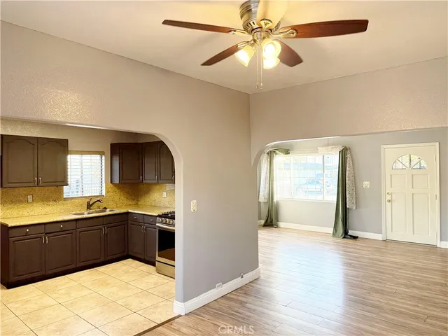 a kitchen with stainless steel appliances granite countertop a sink and cabinets