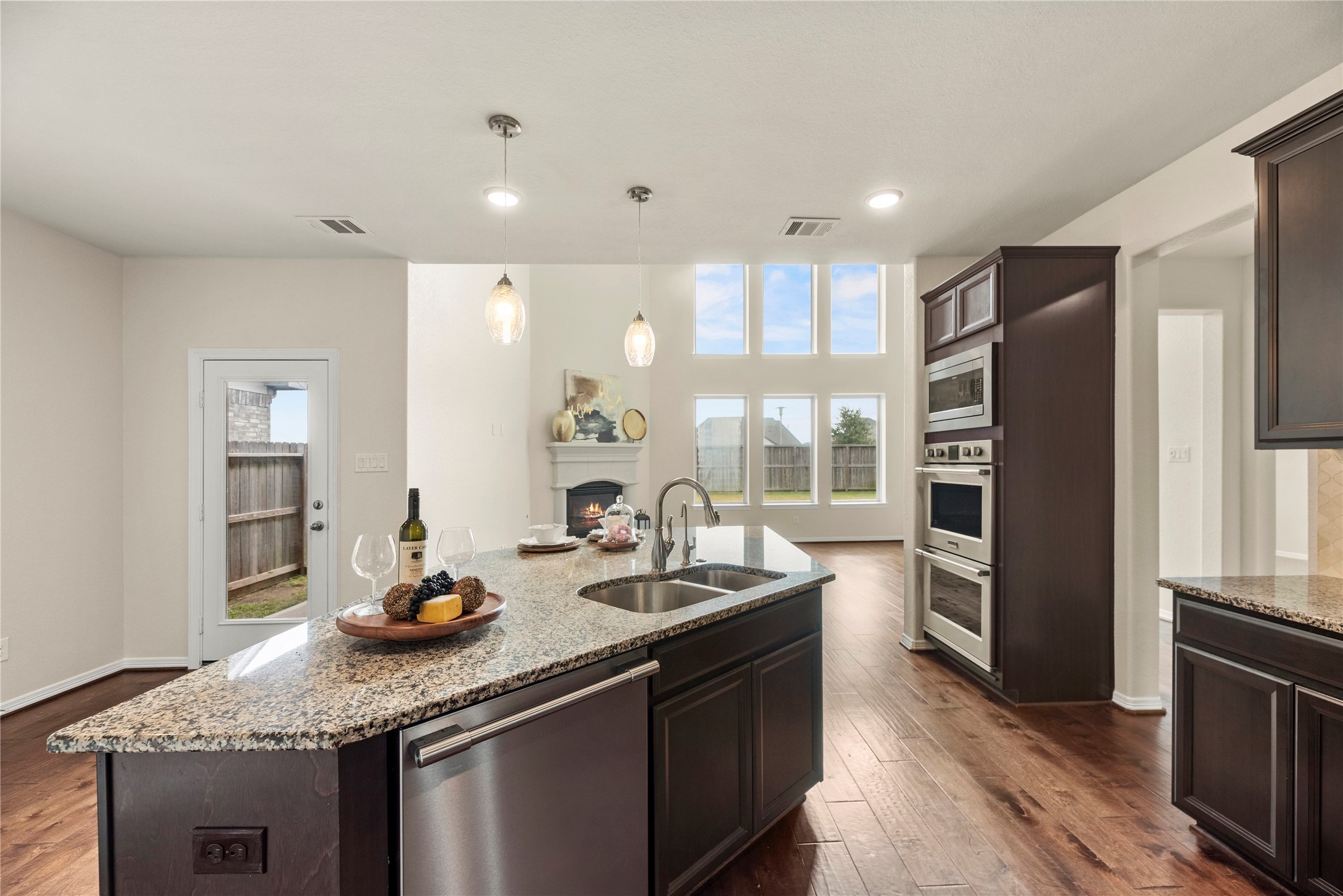 11734 Deepwater Ridge Way Cypress, TX 77433 - Photo 11 of 35 a kitchen with stainless steel appliances granite countertop a sink stove and refrigerator