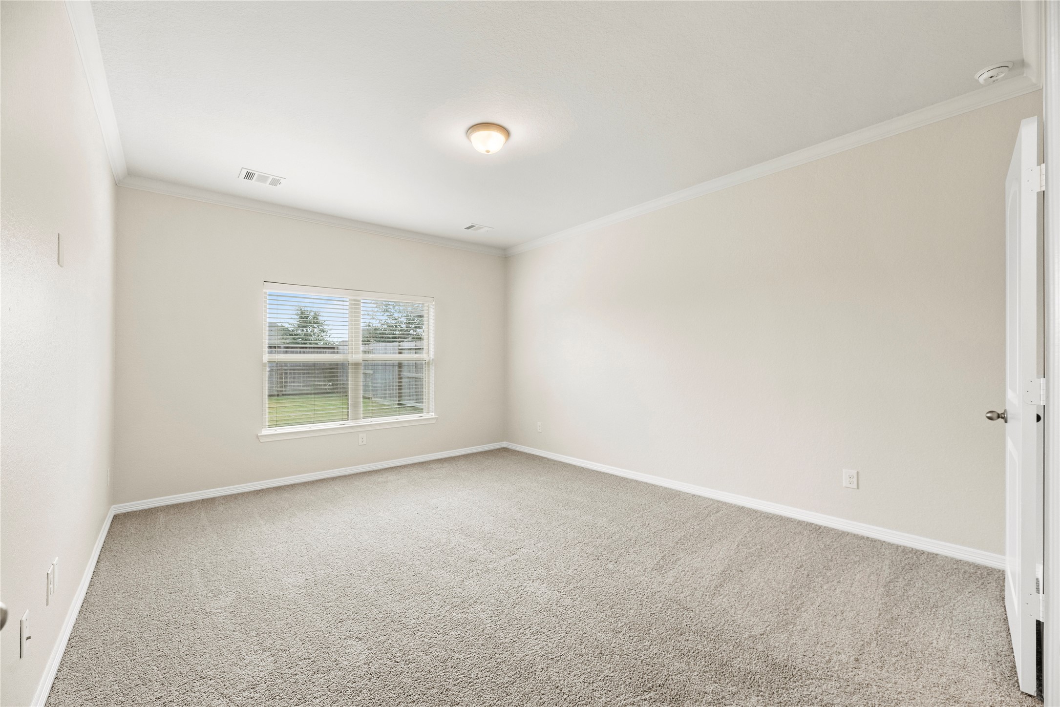 11734 Deepwater Ridge Way Cypress, TX 77433 - Photo 16 of 35 an empty room with a window