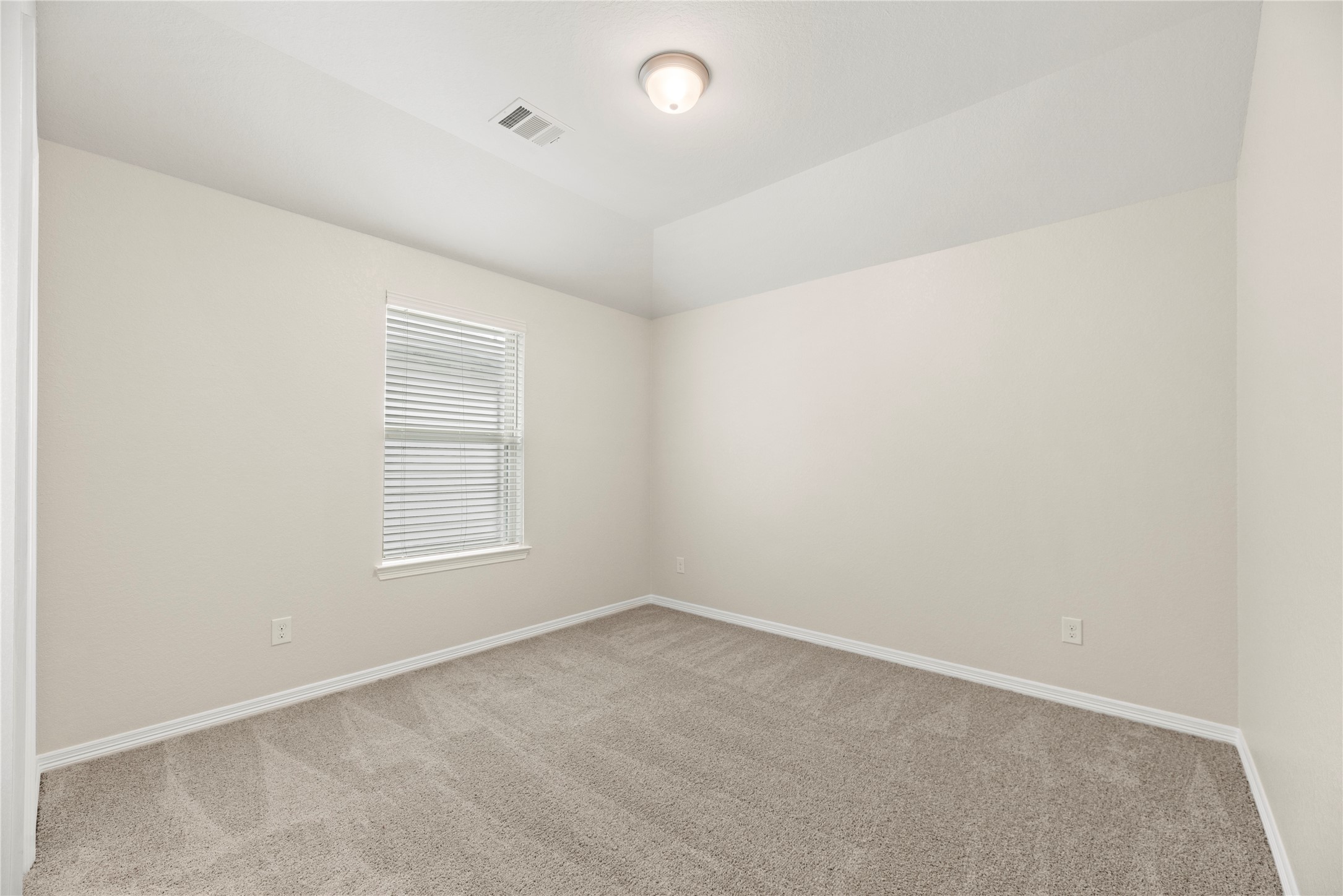 11734 Deepwater Ridge Way Cypress, TX 77433 - Photo 18 of 35 an empty room with a empty space and a window