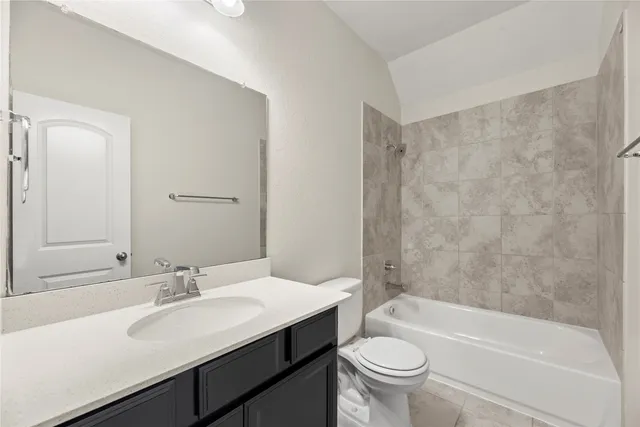 a bathroom with a sink a toilet and a bathtub