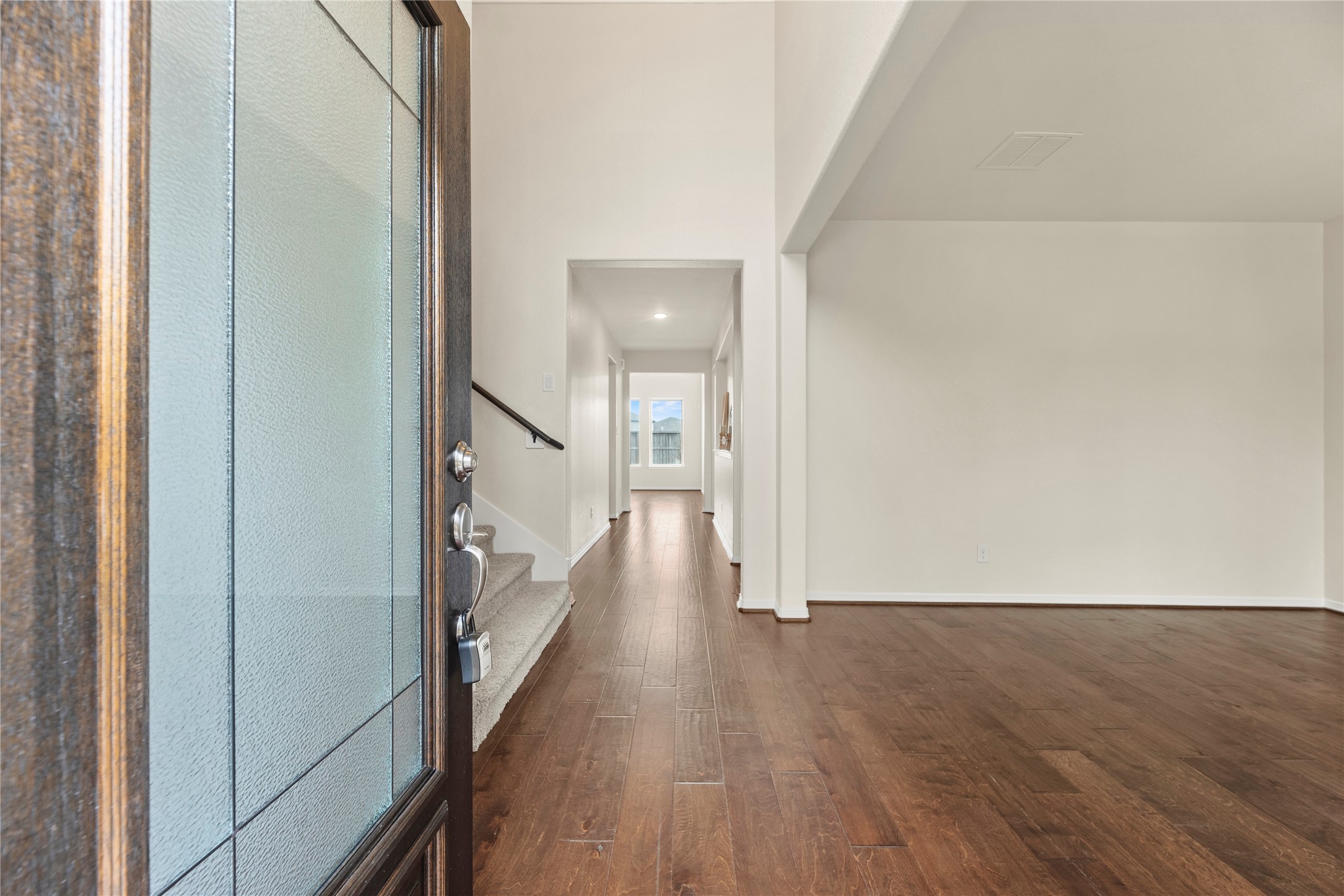 11734 Deepwater Ridge Way Cypress, TX 77433 - Photo 5 of 35 a view of a hallway with wooden floor