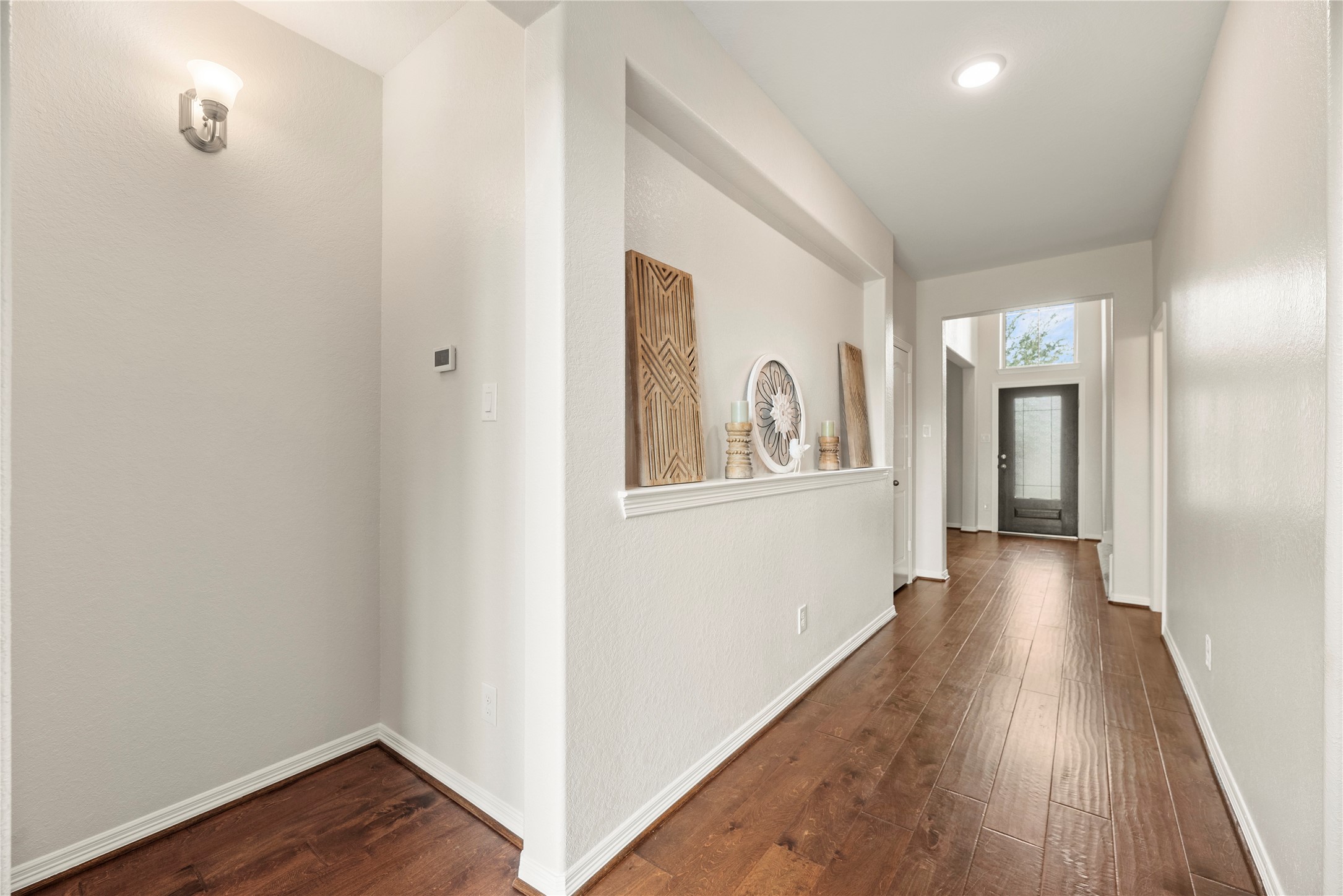 11734 Deepwater Ridge Way Cypress, TX 77433 - Photo 7 of 35 a view of a hallway with wooden floor and closet