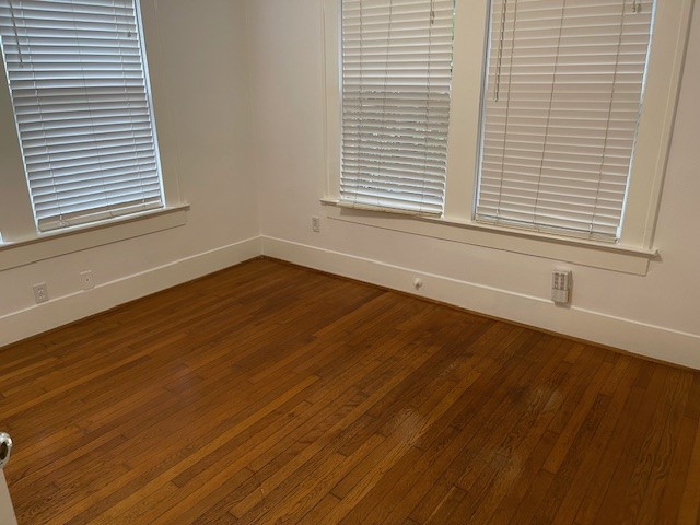 1661 Kipling Street, Unit 2 Houston, TX 77006 - Photo 6 of 10 an empty room with wooden floor and a window